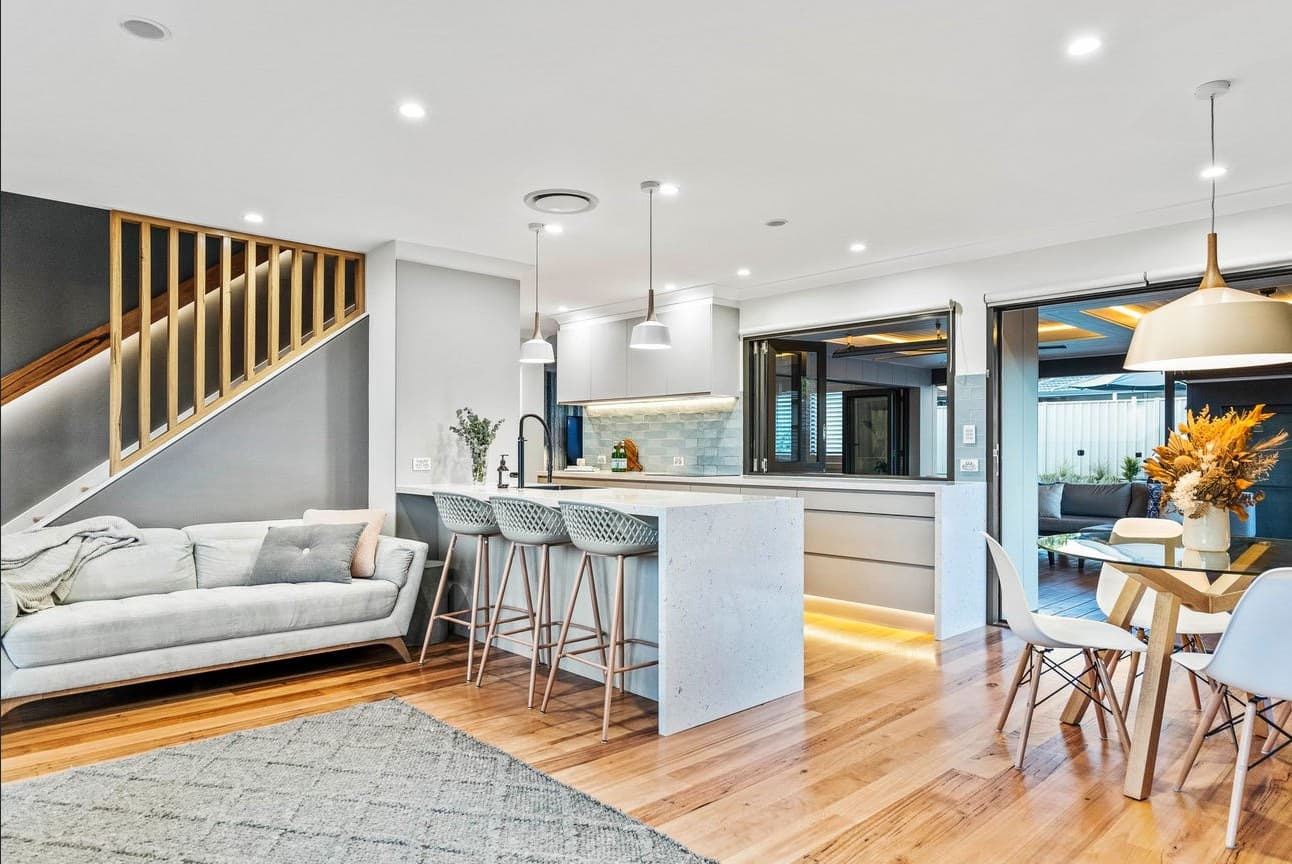 Contemporary open-plan interior with recessed and pendant lighting — NS Electrics