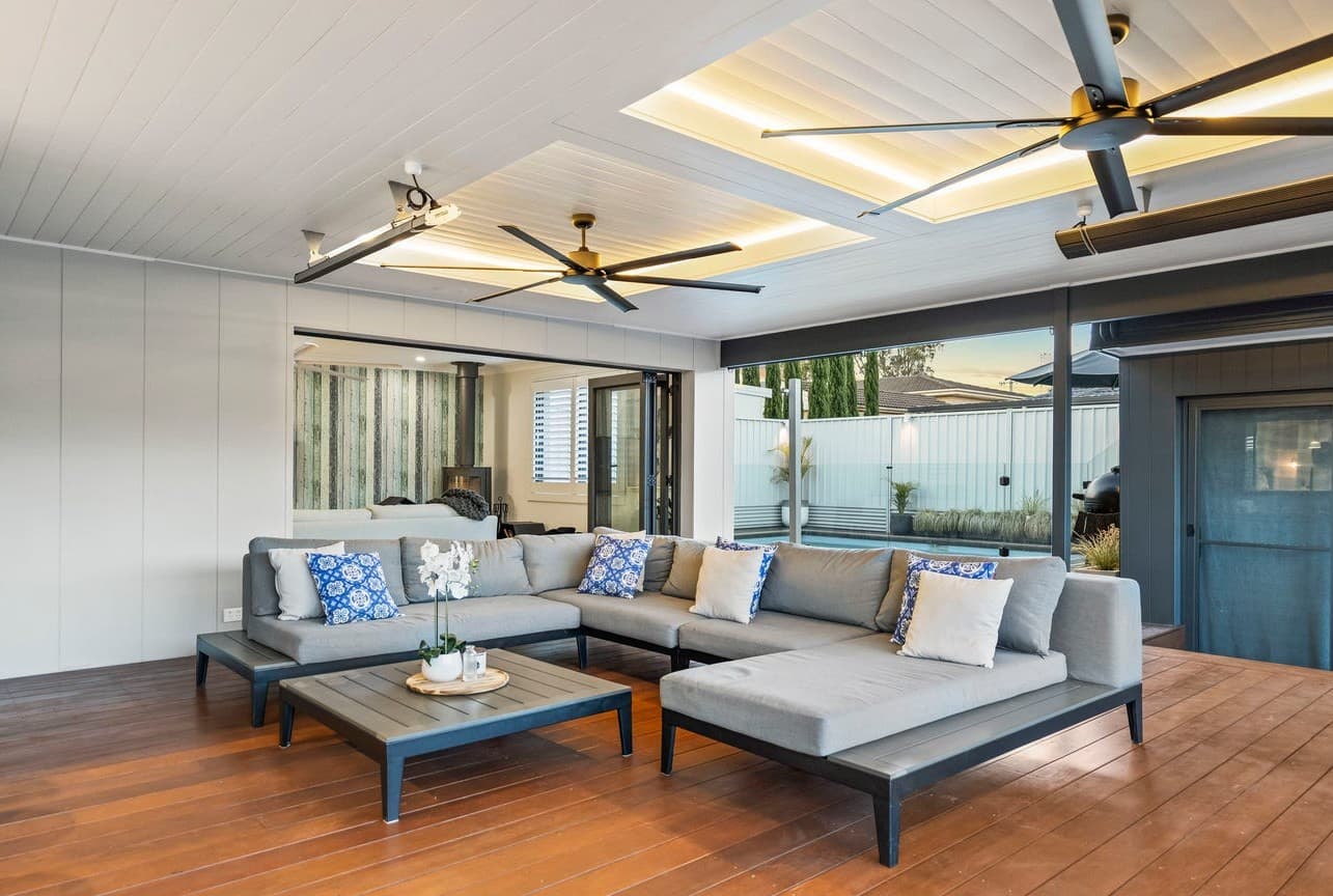 Modern outdoor entertaining area with ceiling fans and integrated LED lighting by NS Electrics