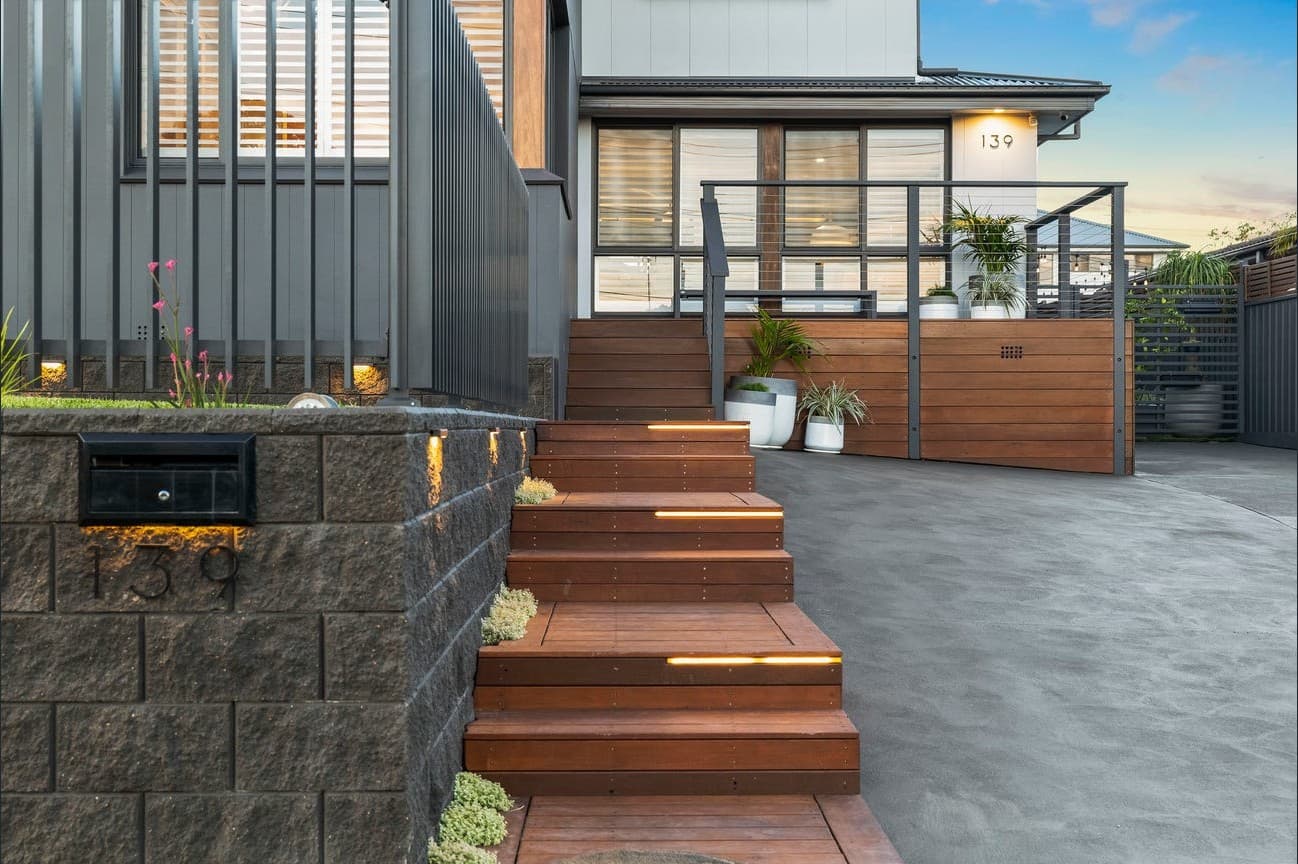 Residential entry and gatehouse with architectural step and deck lighting
