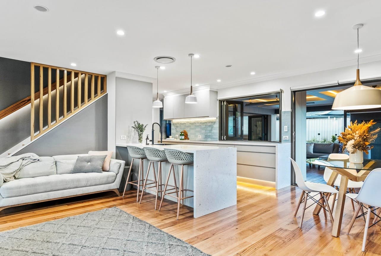 Contemporary open-plan interior with recessed and pendant lighting